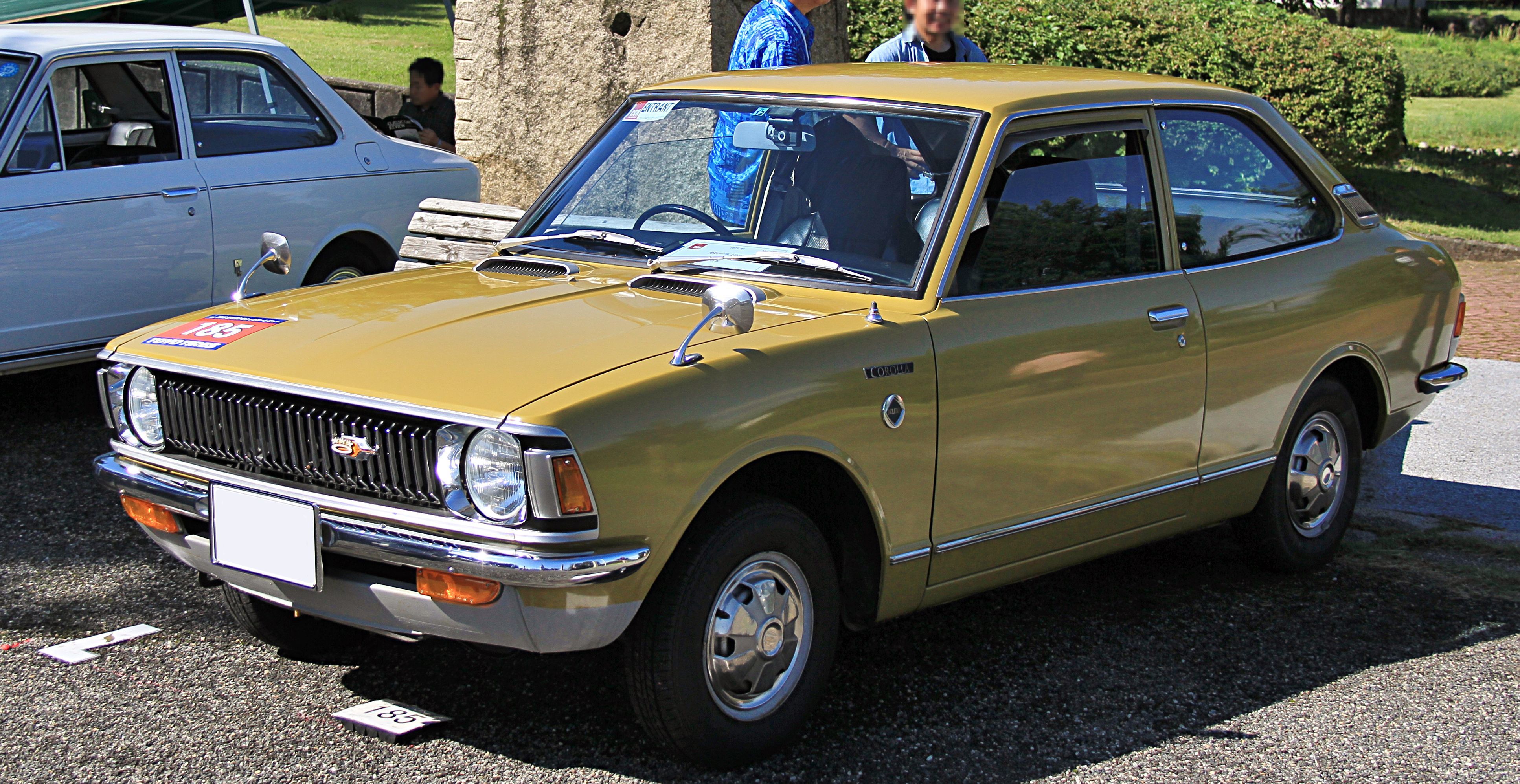 Exact year, E20 generation, two-door body and 1200 Deluxe title; Japanese market and four-speed transmission are not proved by the image alone.