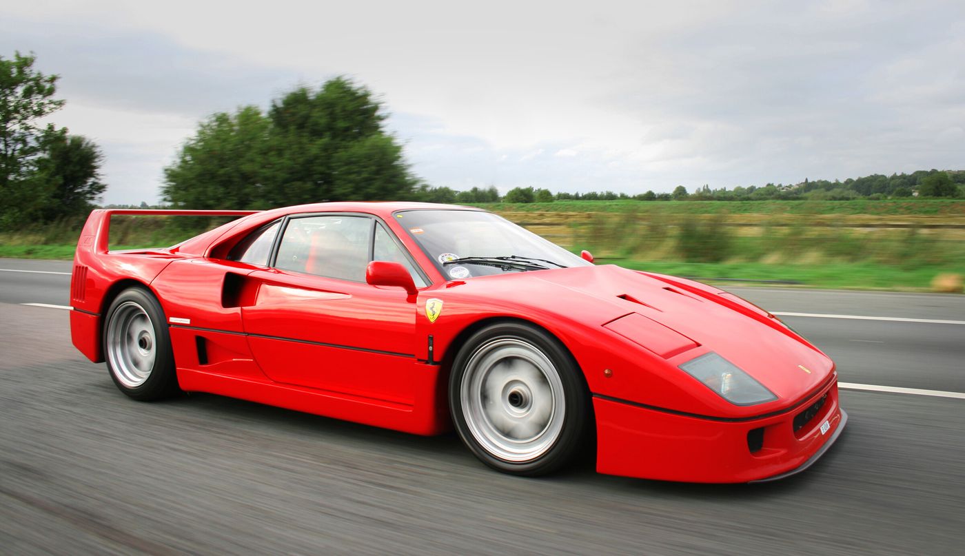 Commons identifies a Ferrari F40 photographed on the road. It is an exact model match, but the image does not prove the car is a 1987 example.