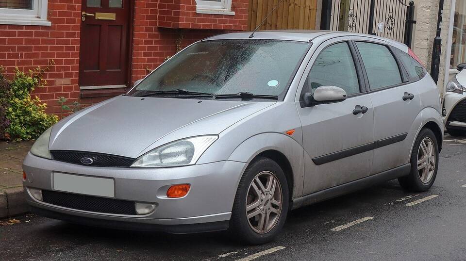 Commons identifies an early UK-registered 1998 Ford Focus Zetec 1.8 five-door. It matches the profile's exact year, European five-door body and Zetec trim family, but uses the 1.8-litre engine rather than the requested 2.0-litre Zetec-E.