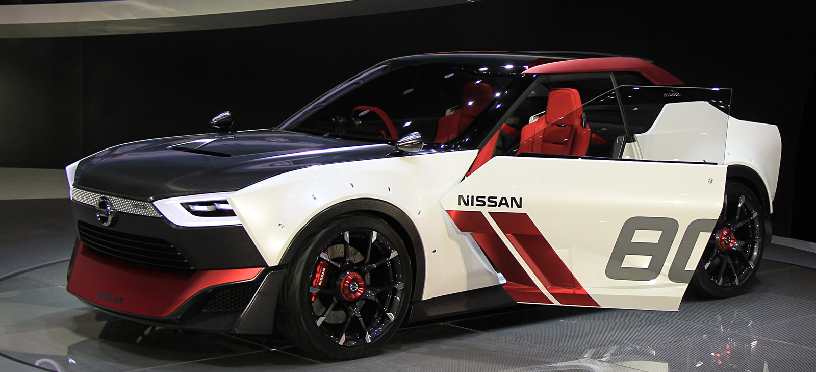 Exact physical wide IDx NISMO exhibited at the 2013 Tokyo Motor Show, with white, red and carbon-style racing treatment; not the narrower IDx Freeflow.