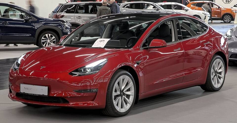 Pre-refresh Tesla Model 3 photographed in 2023; the original exterior body is representative, but this is not verified as a 2017 launch car and wheels/trim may differ.