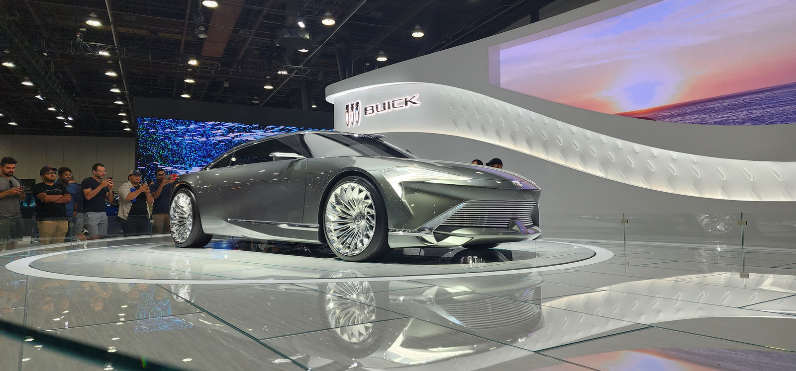 Exact low silver 2022 Wildcat EV physical 2+2 design concept with forward-leaning nose, check-mark lighting and turbine wheels; not an earlier Wildcat or a production Buick crossover.