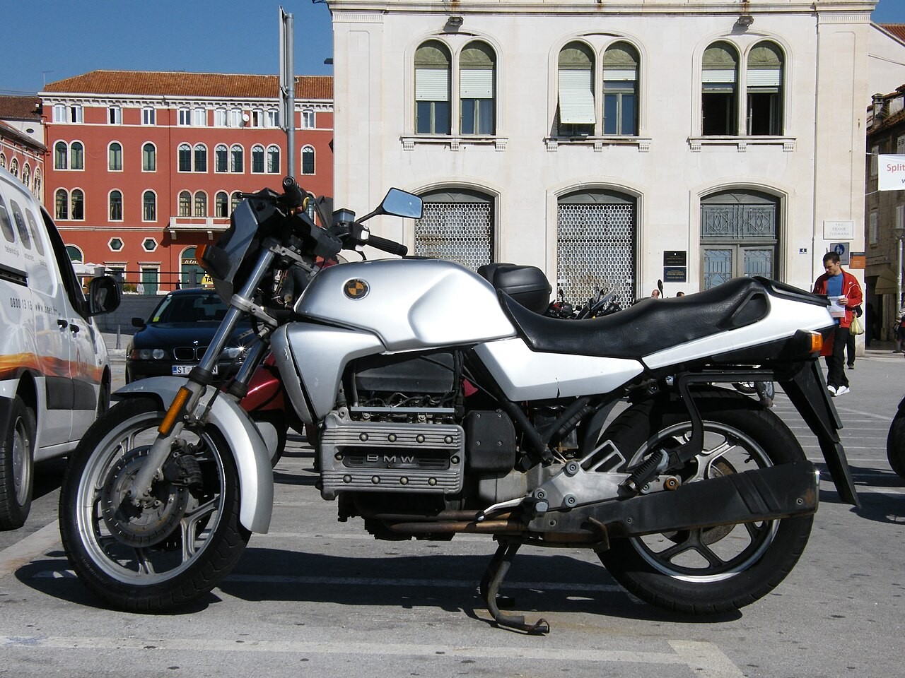 Representative unfaired BMW K100 photographed in Split. Visible exposed engine and absence of RS/RT fairing match the base family; exact model year and originality unverified.