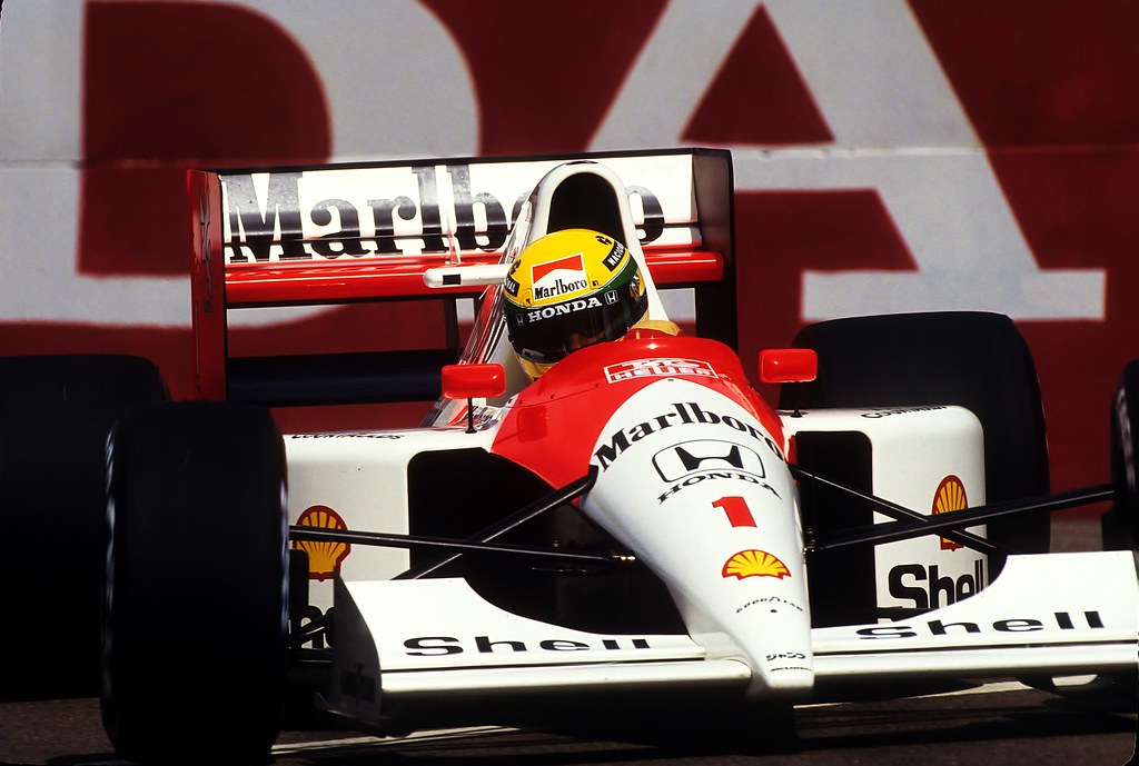 Ayrton Senna driving the red-and-white no. 1 McLaren Honda MP4/6 head-on at the 1991 United States Grand Prix in Phoenix.