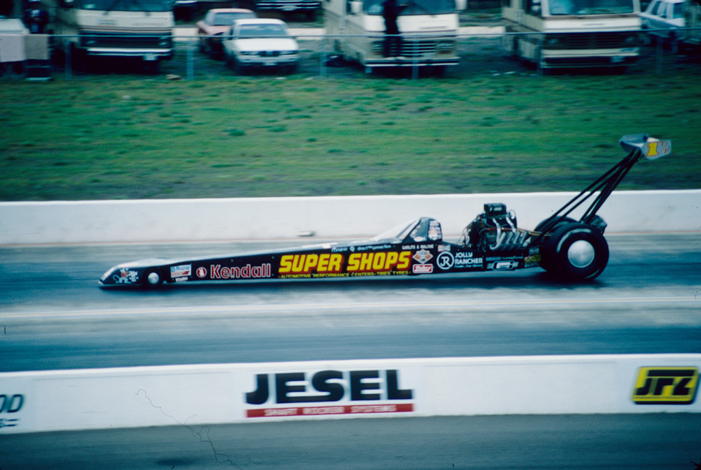 Don Garlits driving the actual streamlined Swamp Rat XXX Top Fuel dragster at Texas Motorplex in 1987; no registration is visible.