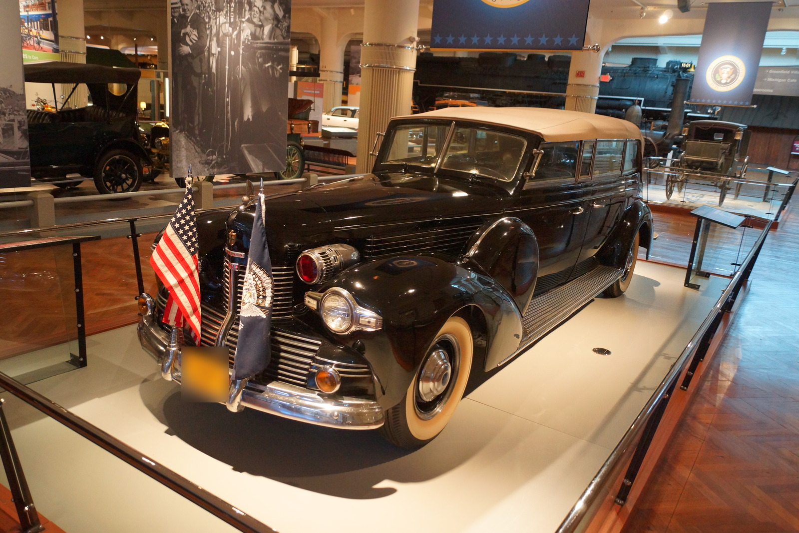 Black 1939 Lincoln Sunshine Special presidential limousine displayed at The Henry Ford with its historic registration obscured.