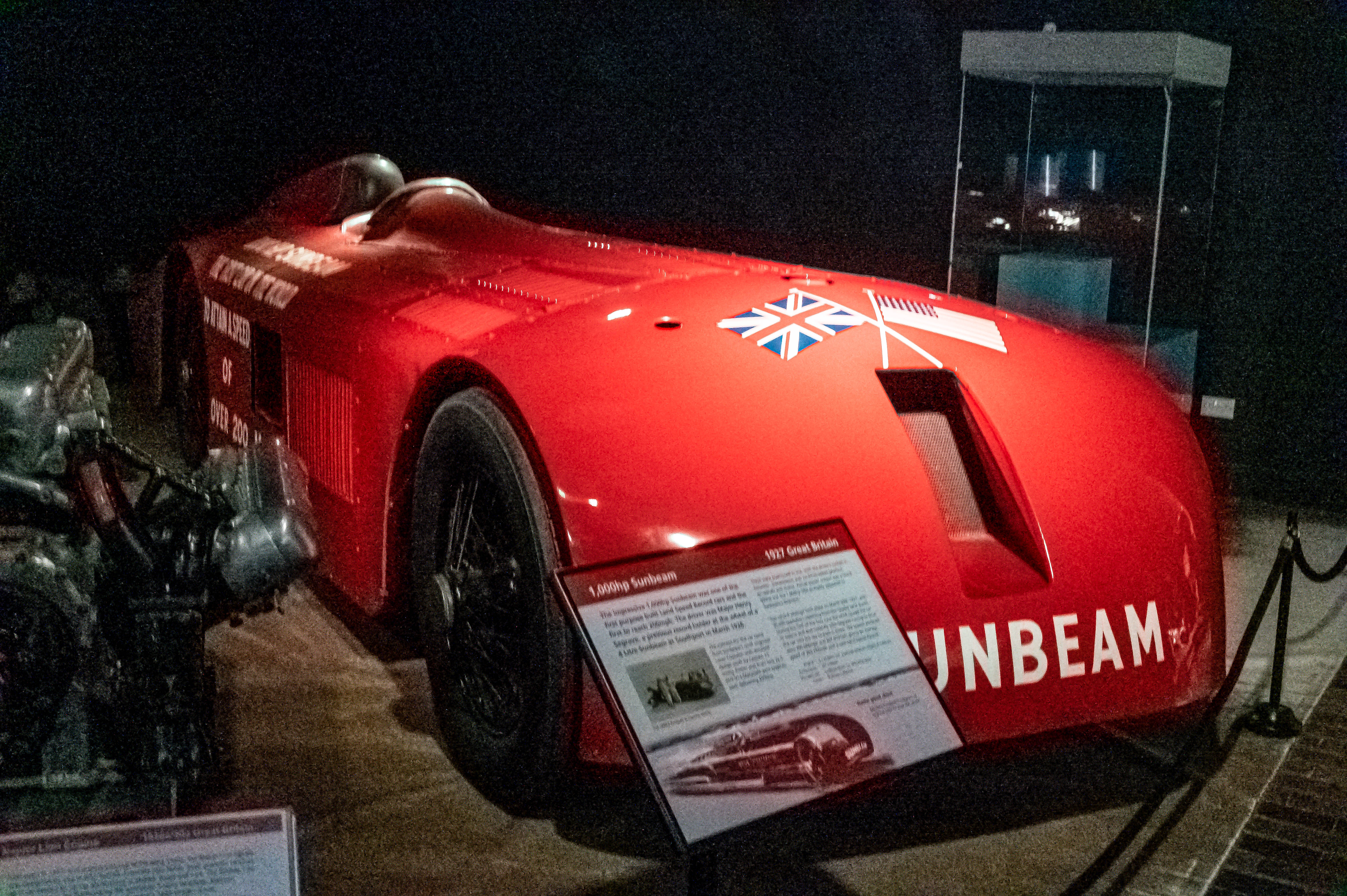 The actual red Sunbeam 1000hp land-speed record car in its National Motor Museum display before the completed 2026 restoration.