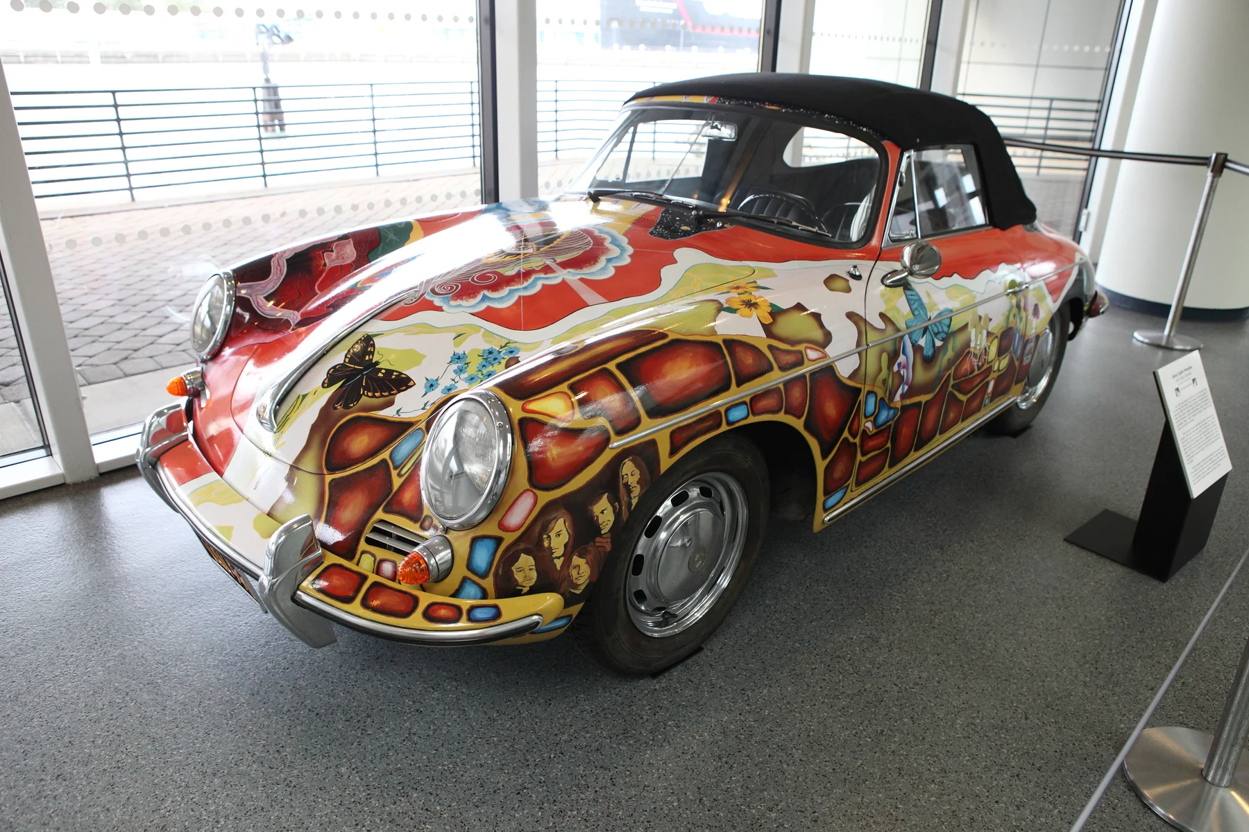 Janis Joplin’s psychedelic Porsche 356 Cabriolet, shown from the front left at the Rock and Roll Hall of Fame.