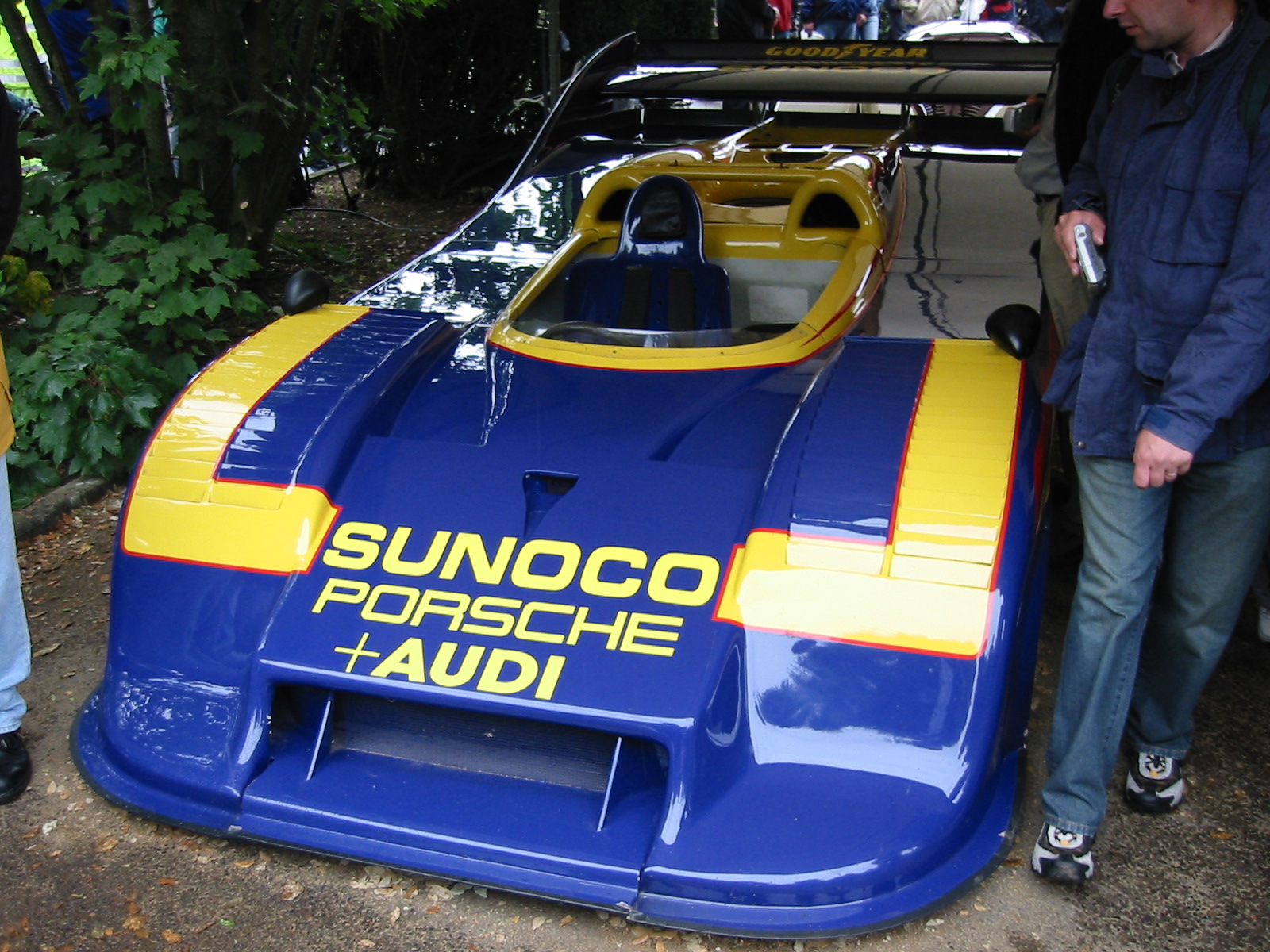 Front view of the actual blue-and-yellow Sunoco Porsche 917/30 later driven by Mark Donohue in the Talladega record attempt, displayed at Goodwood in 2004 with no registration visible.