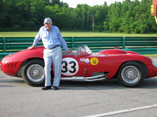 Carroll Shelby standing beside a red Maserati 450S at Virginia International Raceway in 2007.