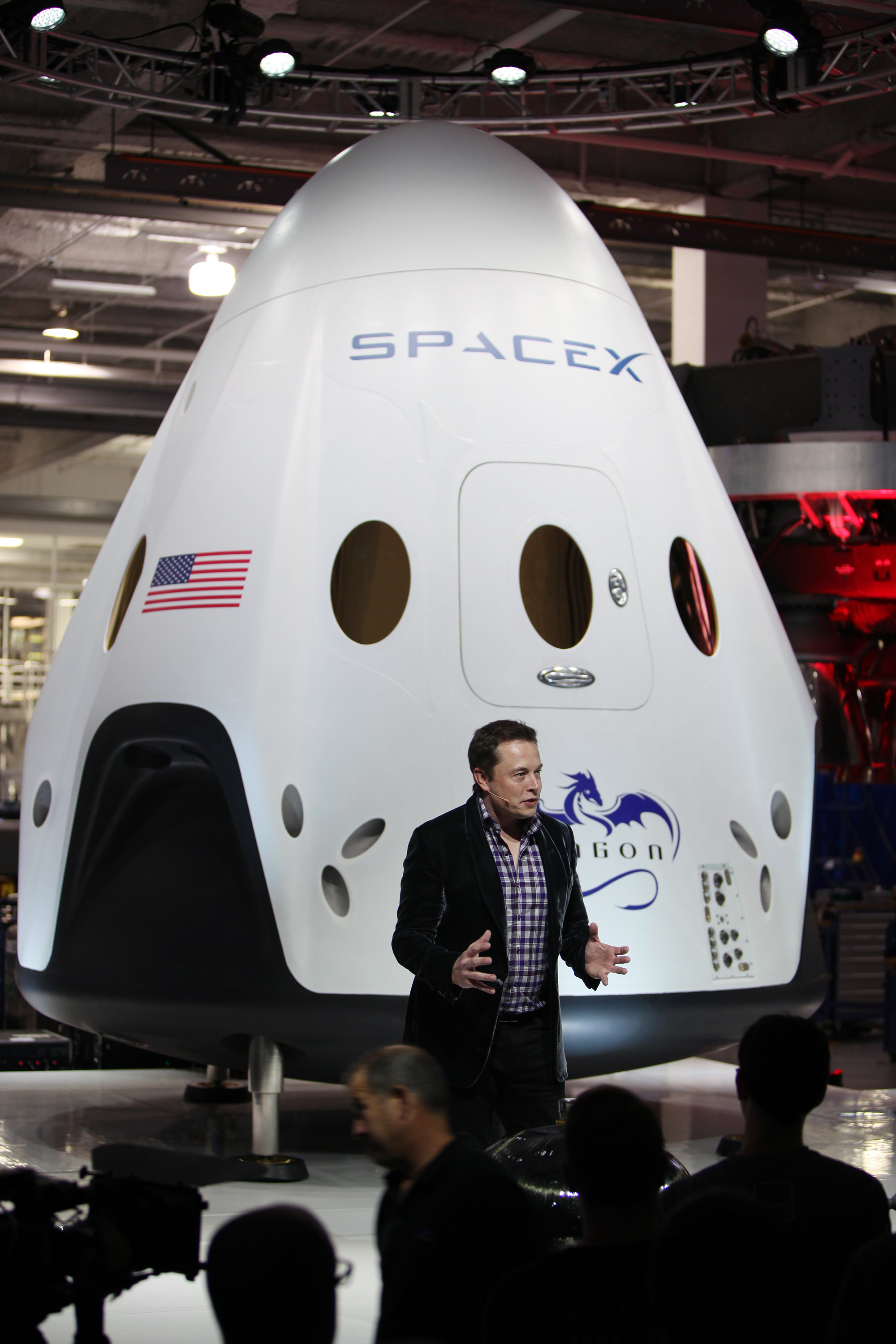 Elon Musk speaking at the Dragon V2 unveiling at SpaceX headquarters on May 29, 2014, photographed by NASA’s Dimitri Gerondidakis.