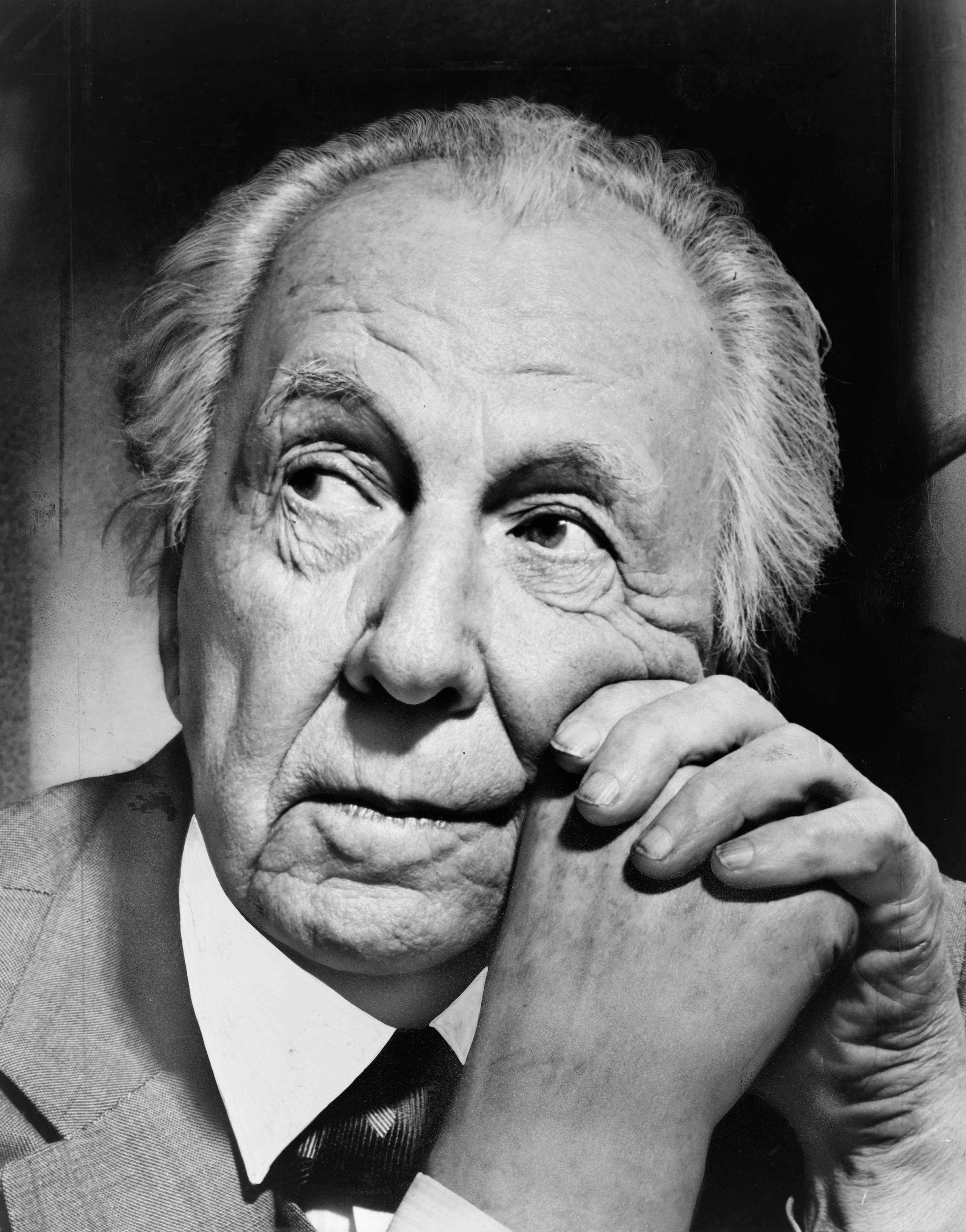 Frank Lloyd Wright in a close head-and-shoulders portrait photographed by Al Ravenna in 1954.