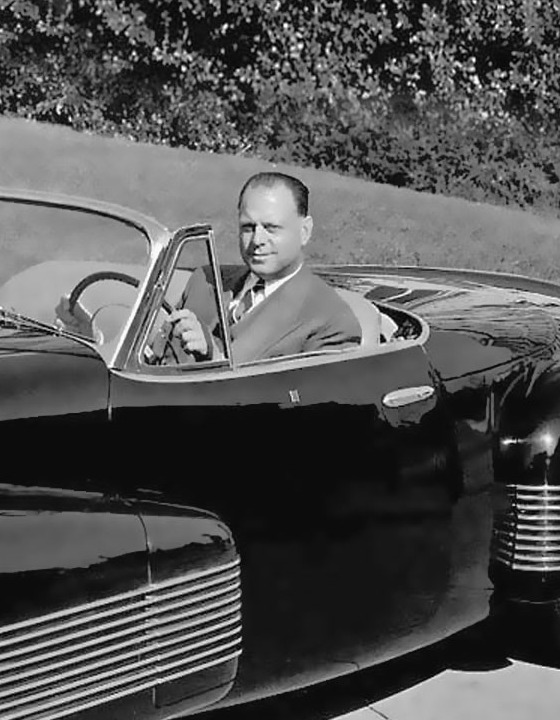 Harley Earl seated behind the wheel of the Buick Y-Job in a cropped 1939 black-and-white photograph.