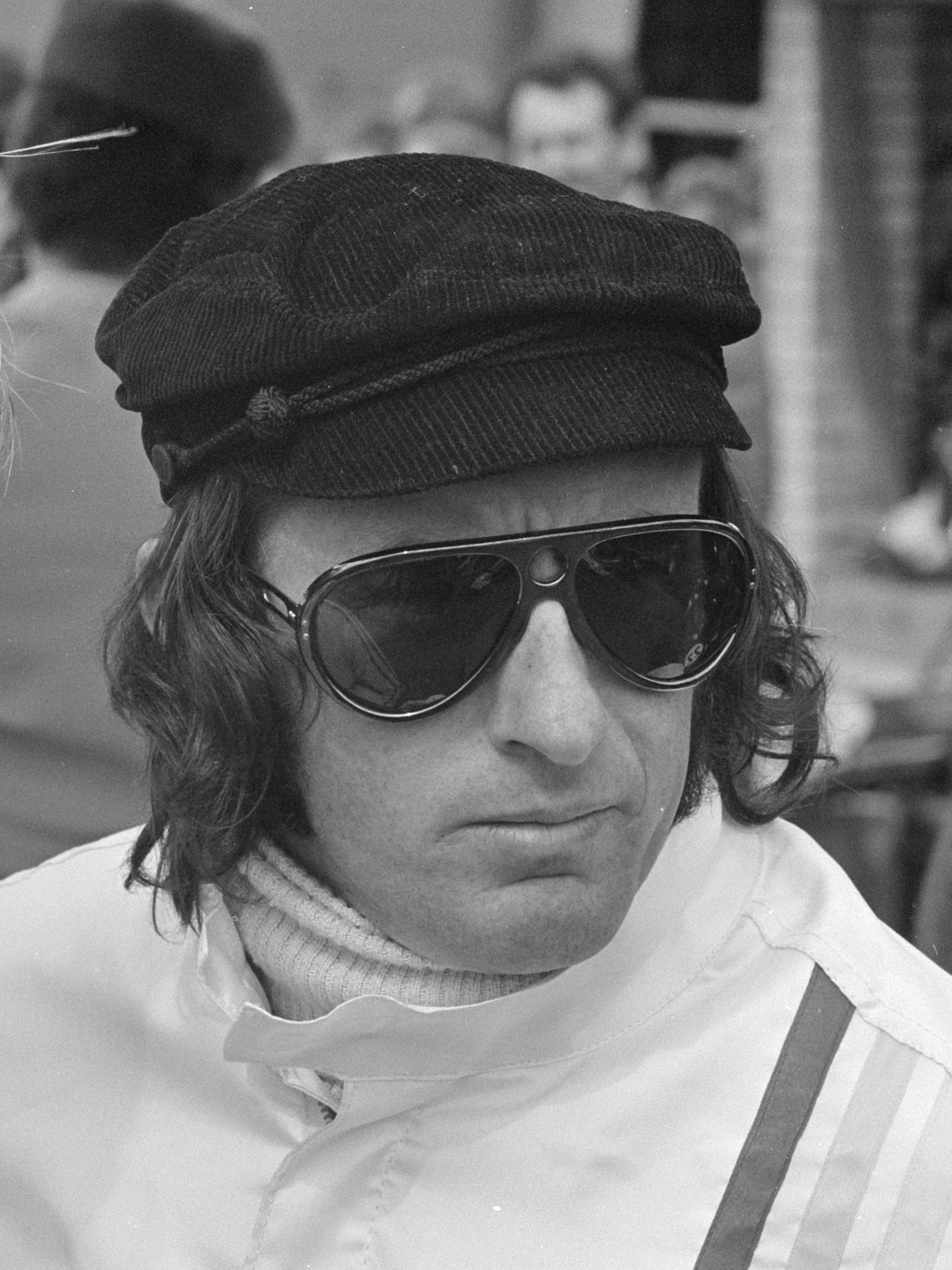 Black-and-white 1971 portrait of Jackie Stewart wearing a cap with racing goggles at Zandvoort.