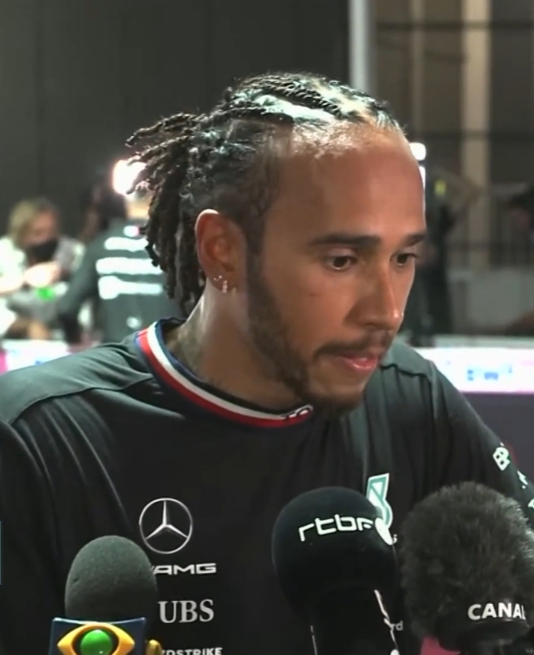 Lewis Hamilton speaking to reporters in a 2021 identification portrait.
