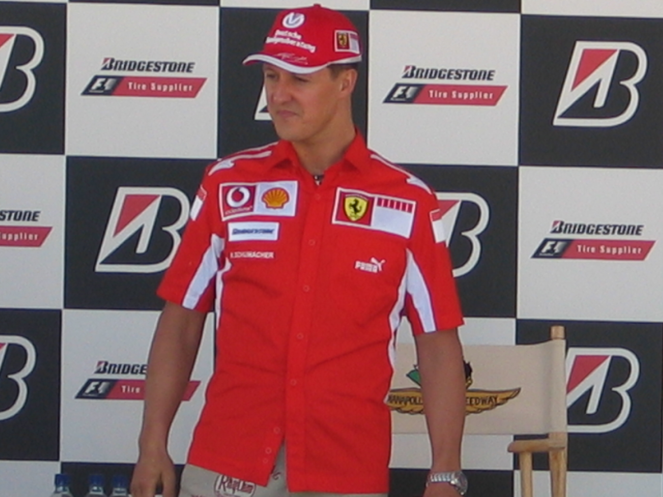 Michael Schumacher in Ferrari team clothing at a United States Grand Prix press conference on June 16, 2005, photographed by Chris J. Moffett.