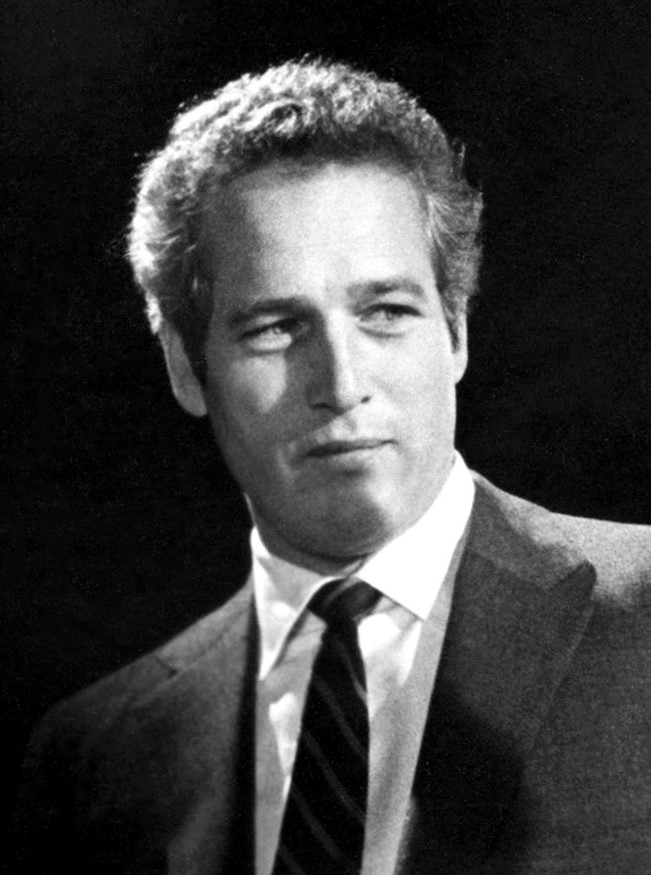 Black-and-white 1970 publicity portrait of Paul Newman in a dark suit and tie.