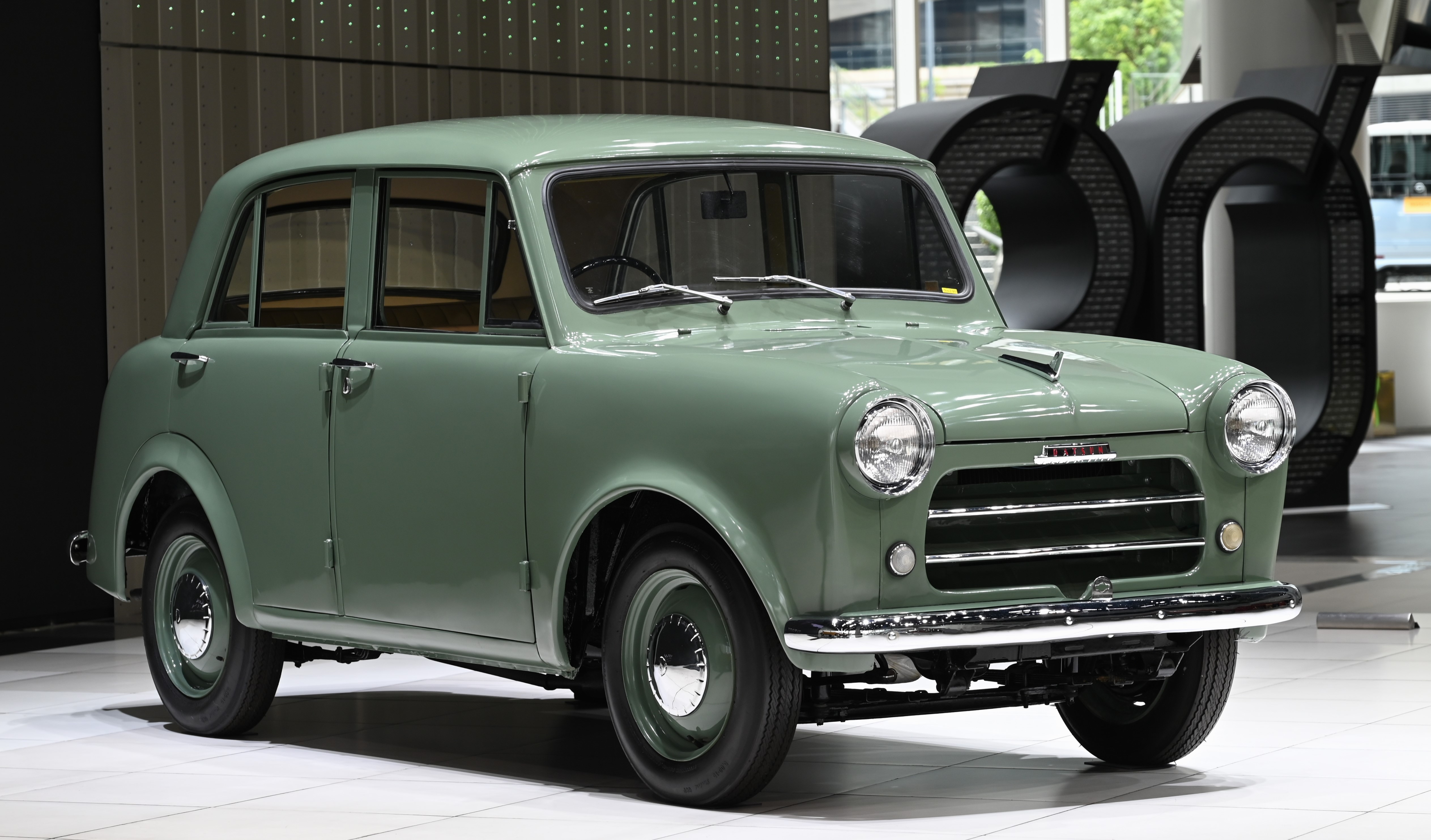 The source explicitly identifies a 1955 Datsun Type 110 Sedan, matching the target A110 family and year.