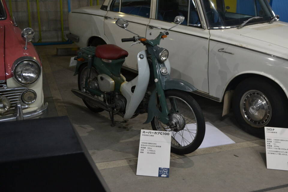 1958 Honda Super Cub C100; the photographed museum placard identifies both model and year