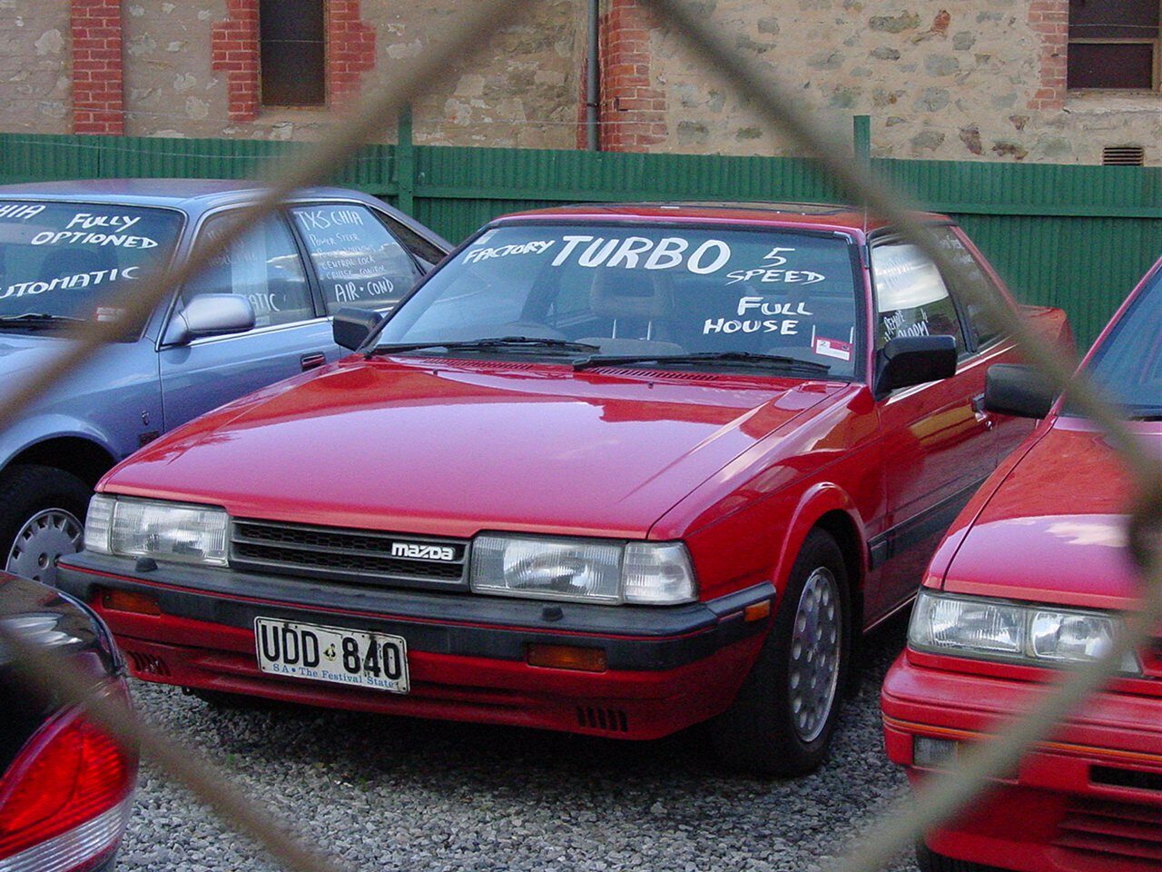 Closest rights-cleared turbo GC lead: a 1986-1987 Australian-market Super Deluxe Turbo coupe. Year, market, trim and body style differ from the European 1985 GT 2.0i Turbo target.