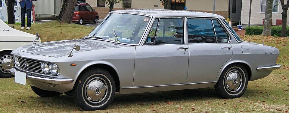 Commons identifies a 1966 Mazda Luce 1500 Deluxe. The photographed four-door body matches the profile; exact mechanical state and originality are not inferred.