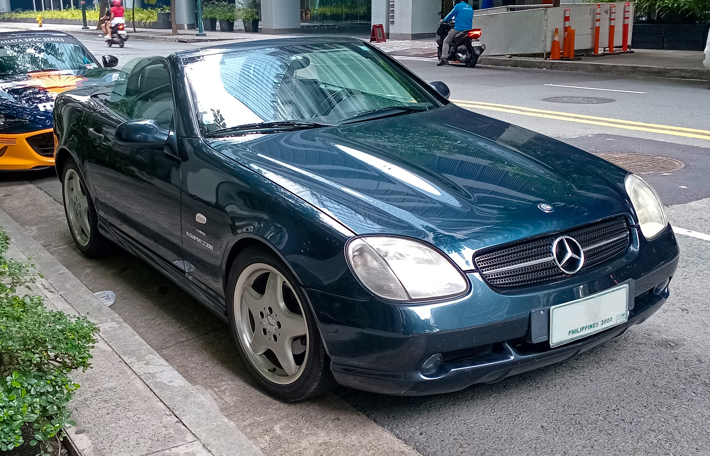 Same R170 generation and exact SLK 230 Kompressor trim, photographed as a 1997 car; it represents the 1996 launch profile and is not claimed as a 1996 chassis.