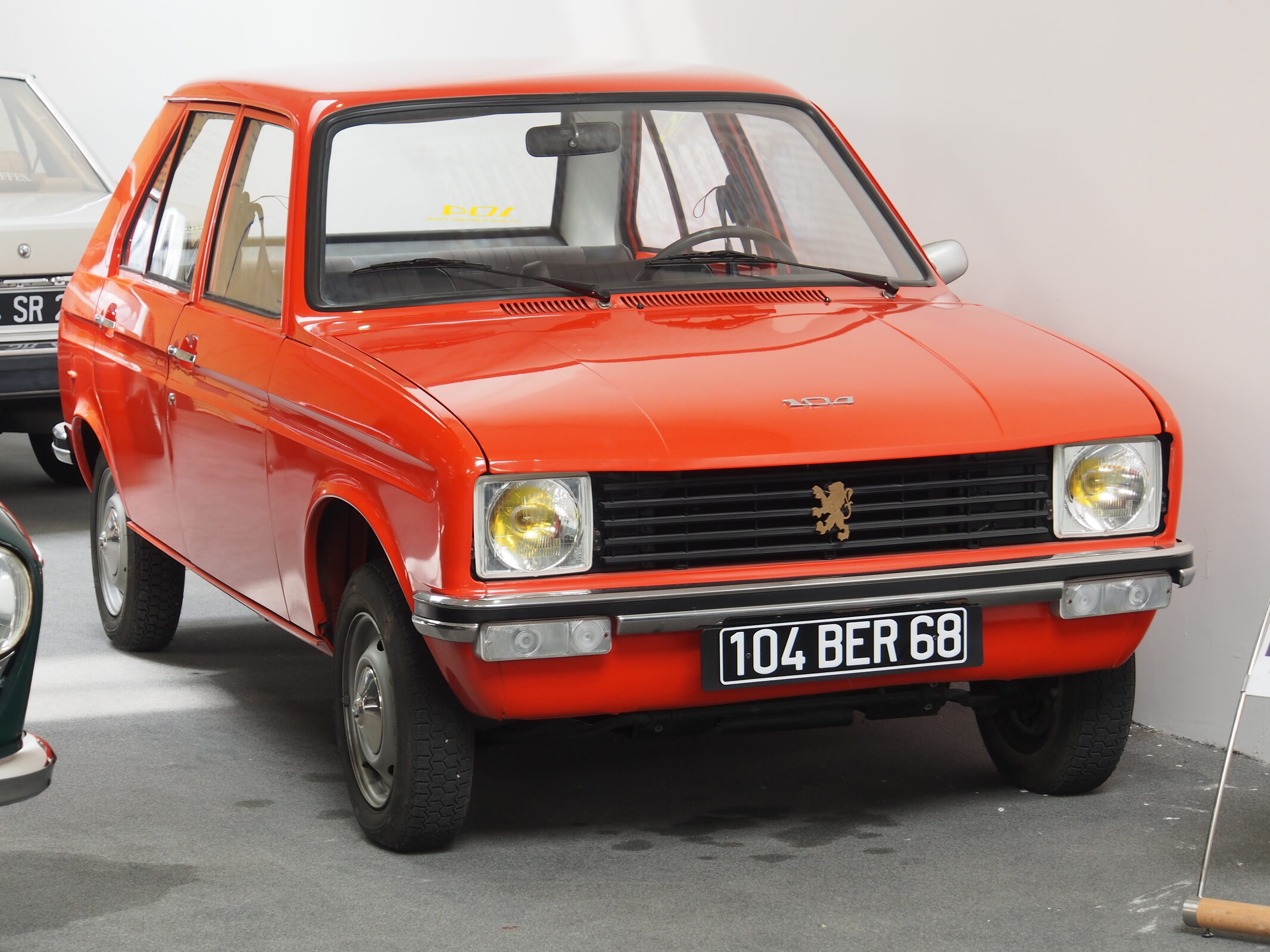 Exact launch-year 104 museum vehicle; source record does not independently state four-door trim.