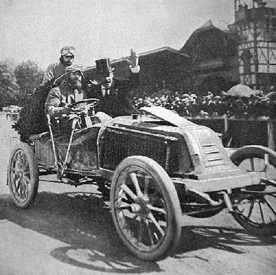 Exact subject and event: Marcel Renault in the Renault Type K that won the 1902 Paris–Vienna race.