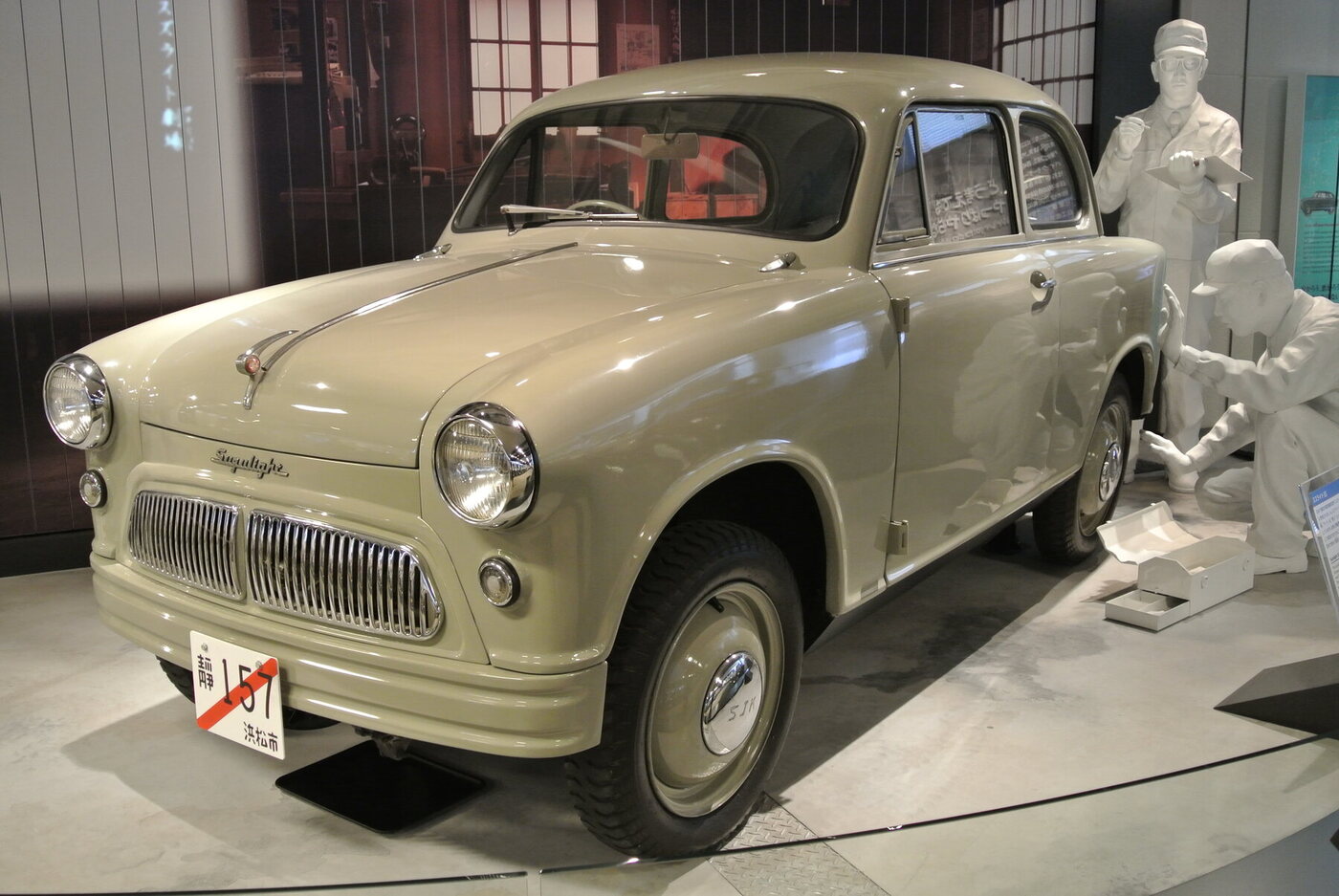 The source identifies the museum car as a 1955 Suzulight SS passenger sedan, not the SL van or SP pickup.