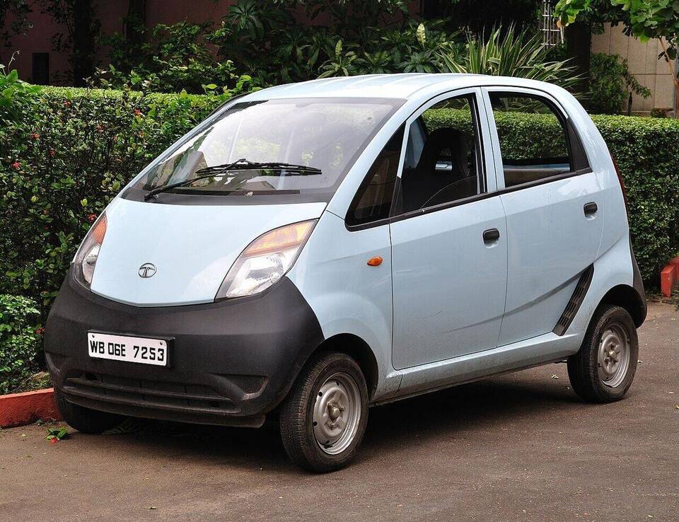 Original-generation Indian Tata Nano, pale blue with unpainted black bumper; photographed in Kolkata on 15 September 2011; exact model year unconfirmed