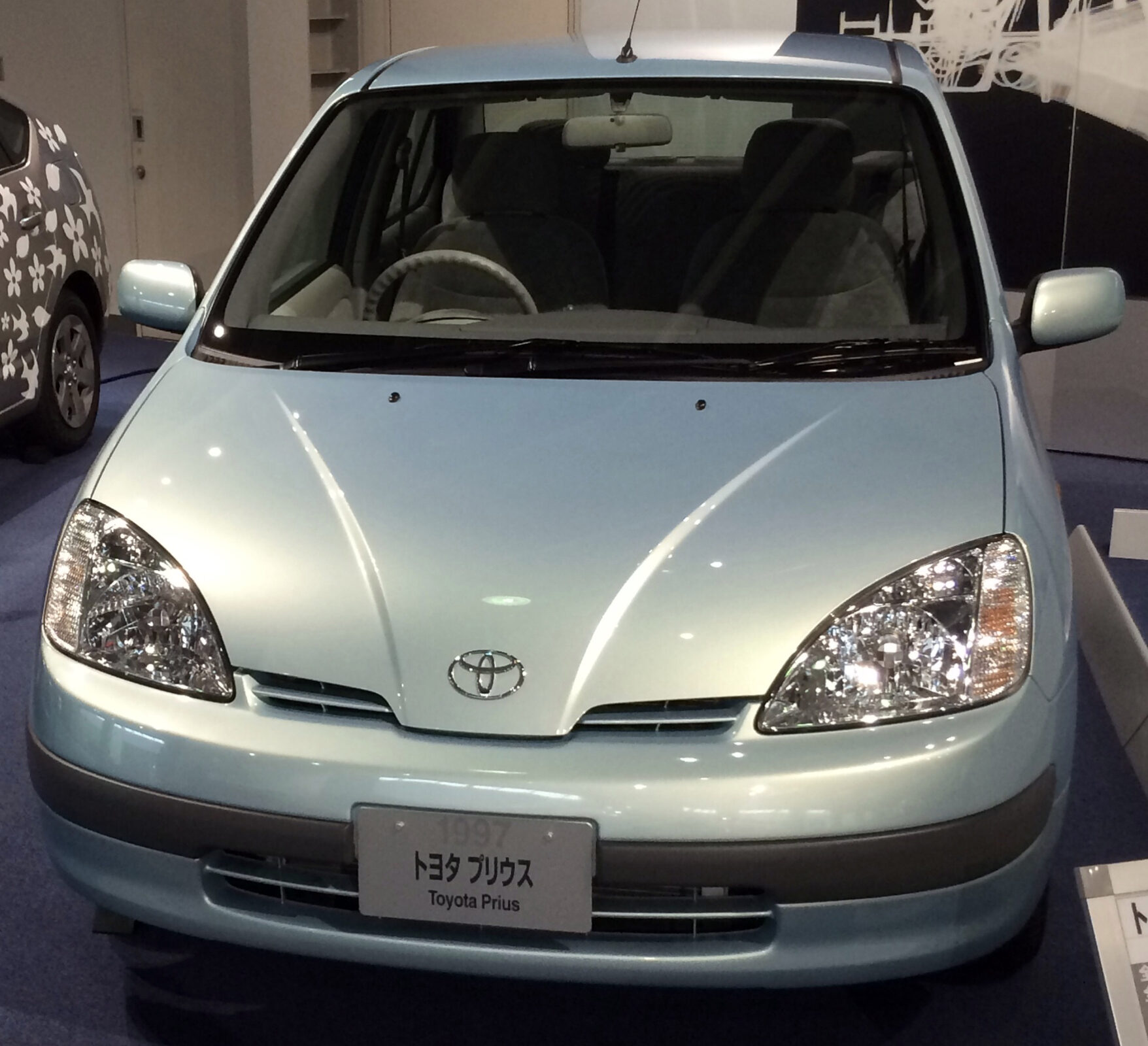 Exact 1997 NHW10 museum vehicle; front-only composition does not independently establish grade.