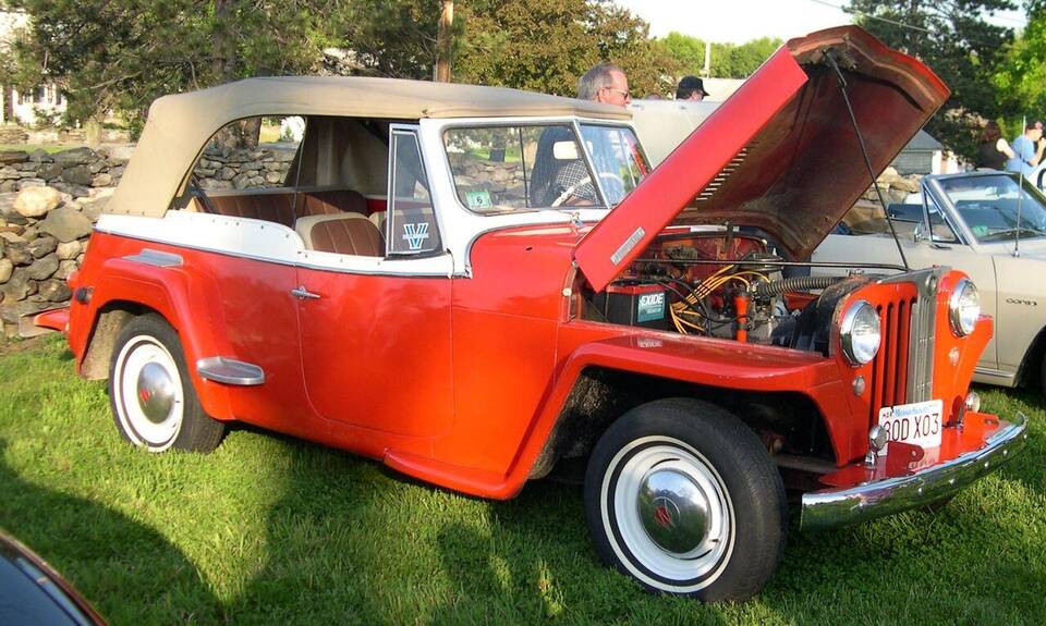 Commons identifies a 1948 Willys Jeepster. The photograph supports the body and model-year identity, while the VJ-2 subseries is not legible from the image alone.